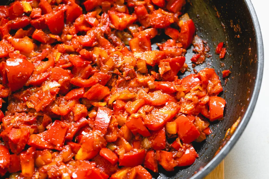 a pan of food with red food in it